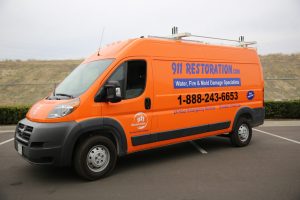 911 Restoration Van Going to a Water Cleanup Job