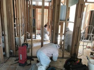 Technicians Renovating a Home After a Flood