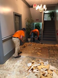 Crew Members Cleaning up a Property Flood