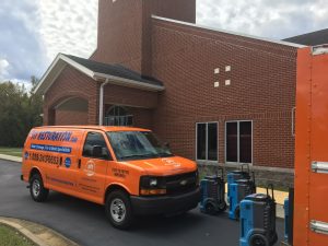 side angle water damage restoration van